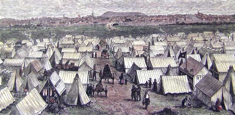 An 1852 coloured print of Canvas Town: rows of white tents across a plain, figures and a horse and cart on the central track, a town on the ridge beyond.